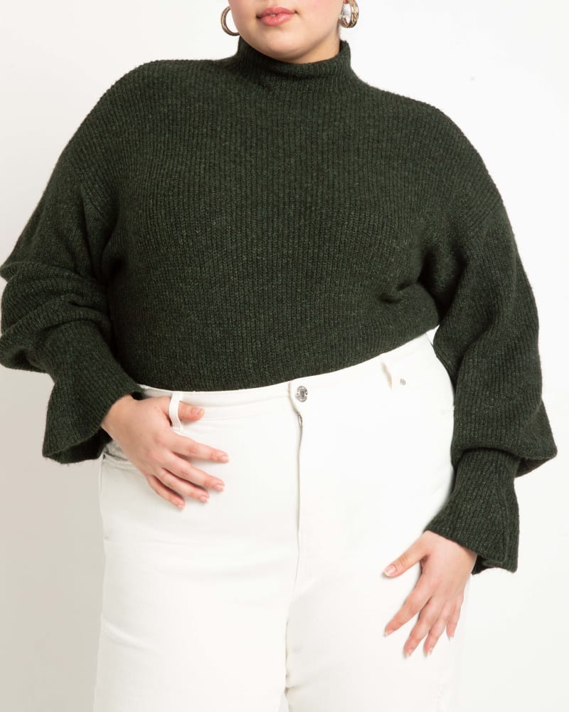 Front of a model wearing a size 14/16 Alisha Flare-Sleeve Sweater in Scarab by ELOQUII. | dia_product_style_image_id:241955